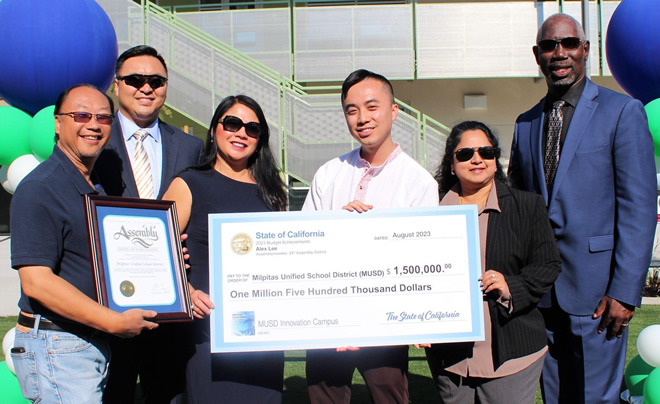 Asm. Lee and other holding large ceremonial check