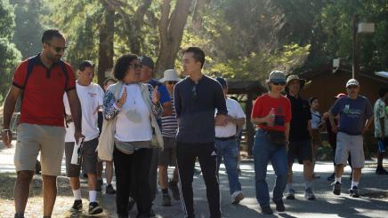 Assemblymember Alex Lee speaks with a participant of the Community Walk and Talk event.
