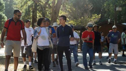 Assemblymember Alex Lee speaks with a participant of the Community Walk and Talk event.