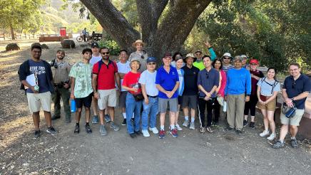 Participants of the Community Walk and Talk event assemble for a group photo.