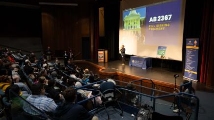 Students and guests at the bill signing event