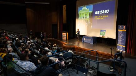 Students and guests at the bill signing event