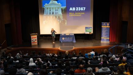 Students and guests at the bill signing event