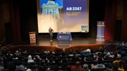 Students and guests at the bill signing event