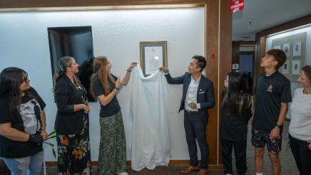 Asm. Lee unveiling official plaque with students and guests