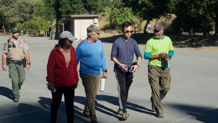 Participants of the Community Walk and Talk event hike along the Penitencia Creek trail with Assemblymember Alex Lee.